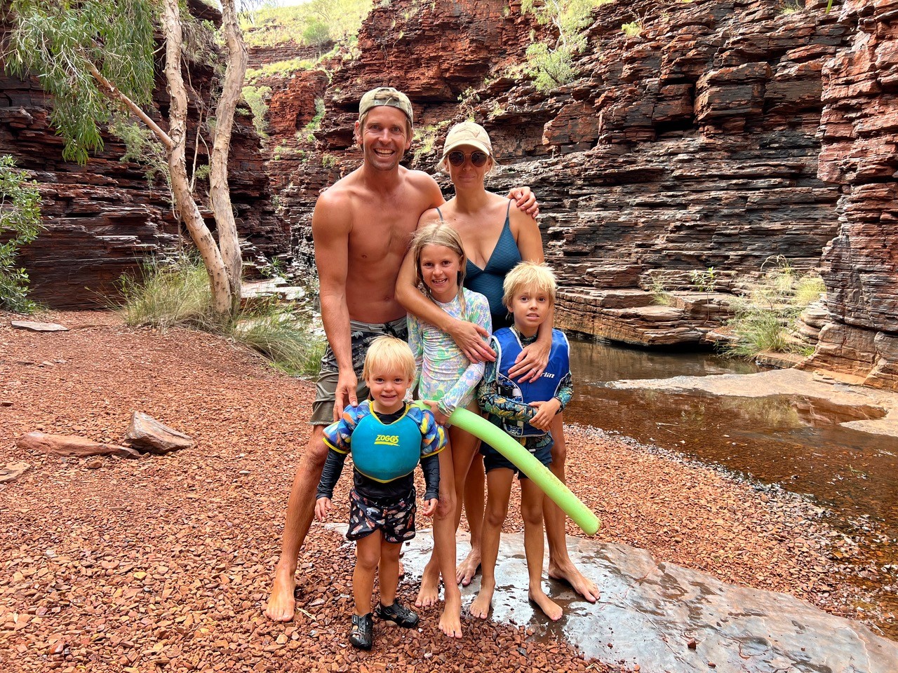 Mark Lecras and family swimming in Karijini